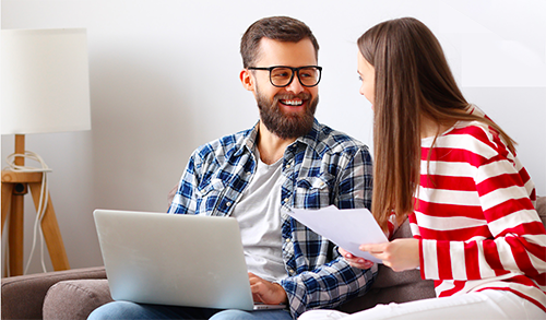 Couple using laptop