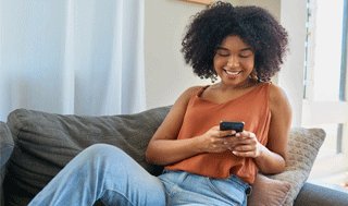 Woman reading on her mobile phone